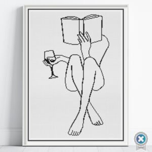 Woman Reading Cross Stitch Pattern