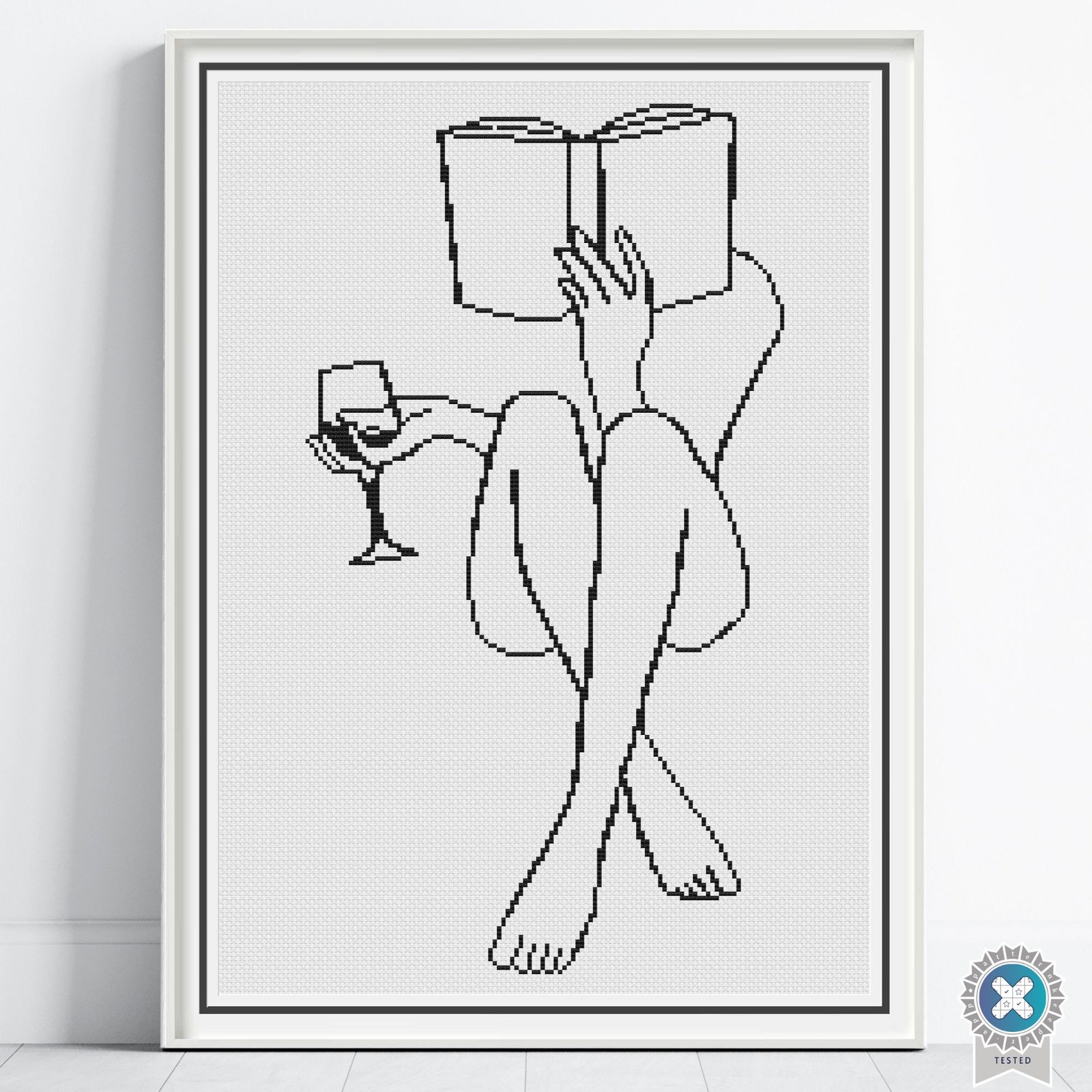 Woman Reading Cross Stitch Pattern